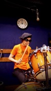 Anthea wears size S (Orange with Black Logo)